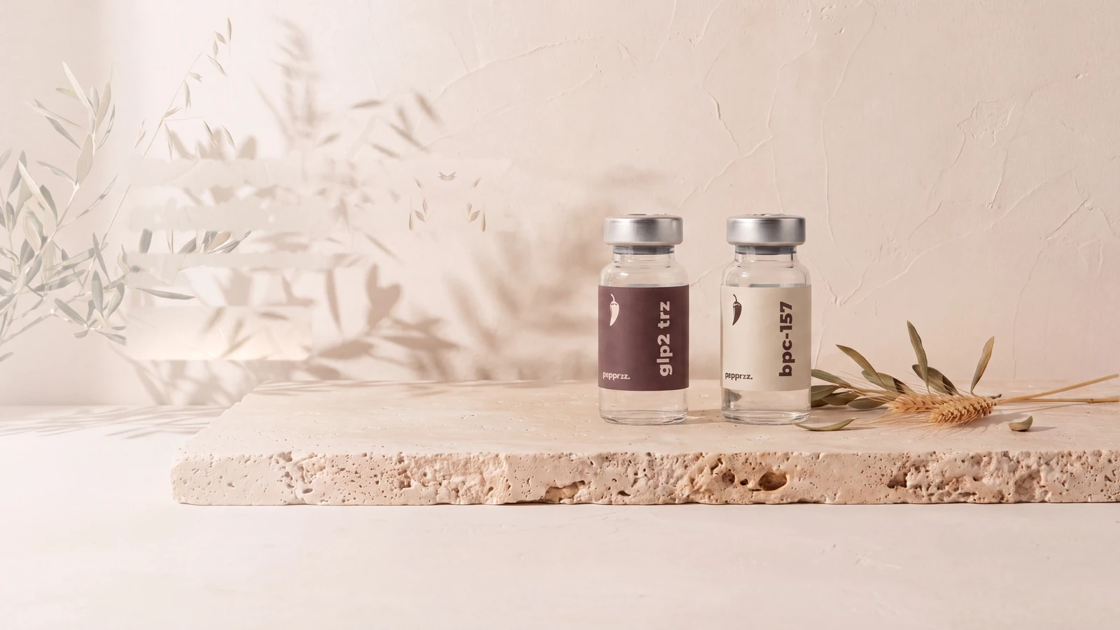 glp2 trz and bpc-157 research vials on a travertine slab